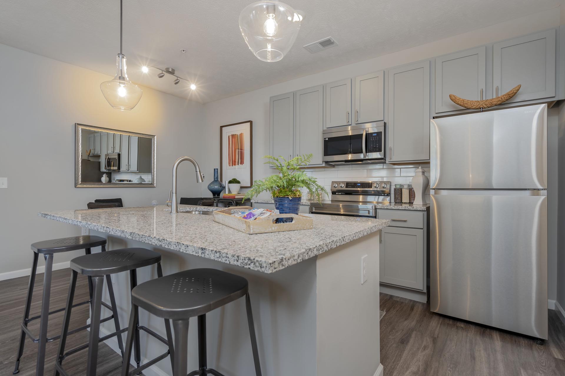 Kitchen kitchen with island equipped with stainless steel appliances and granite countertops